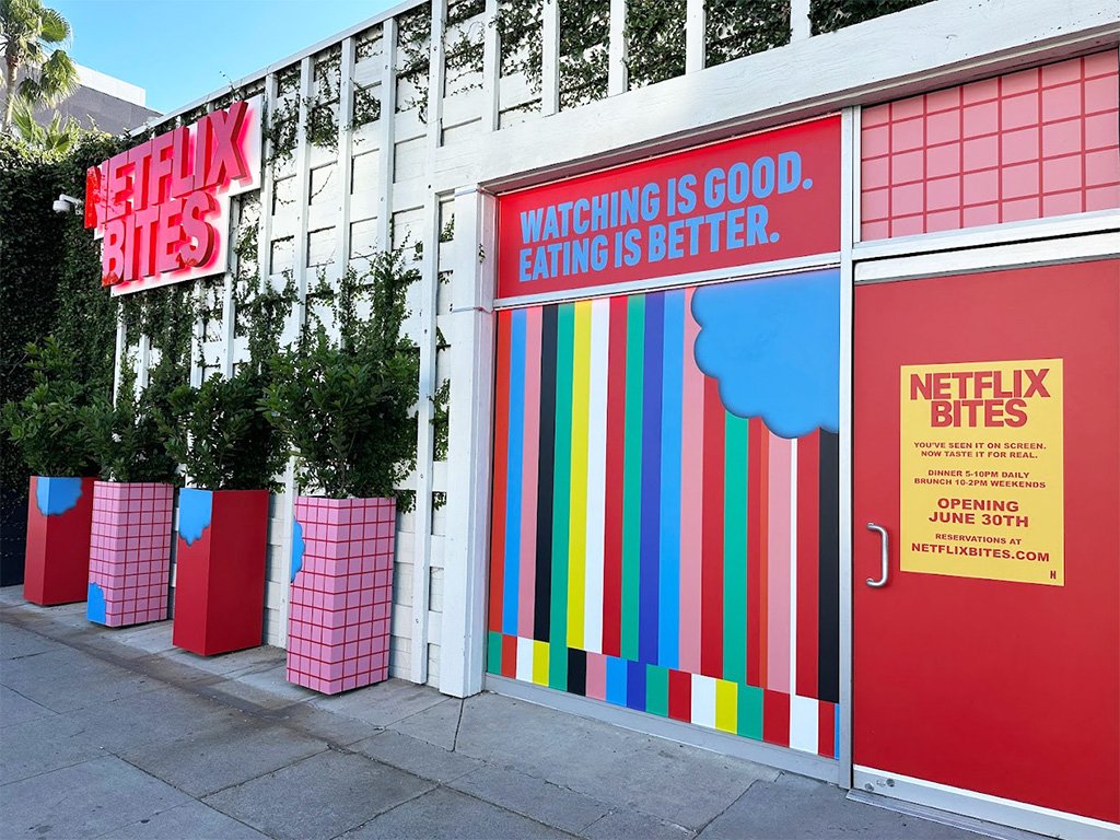 Front of the Netflix Bites Restaurant featuring a large red sign and the front entrance.